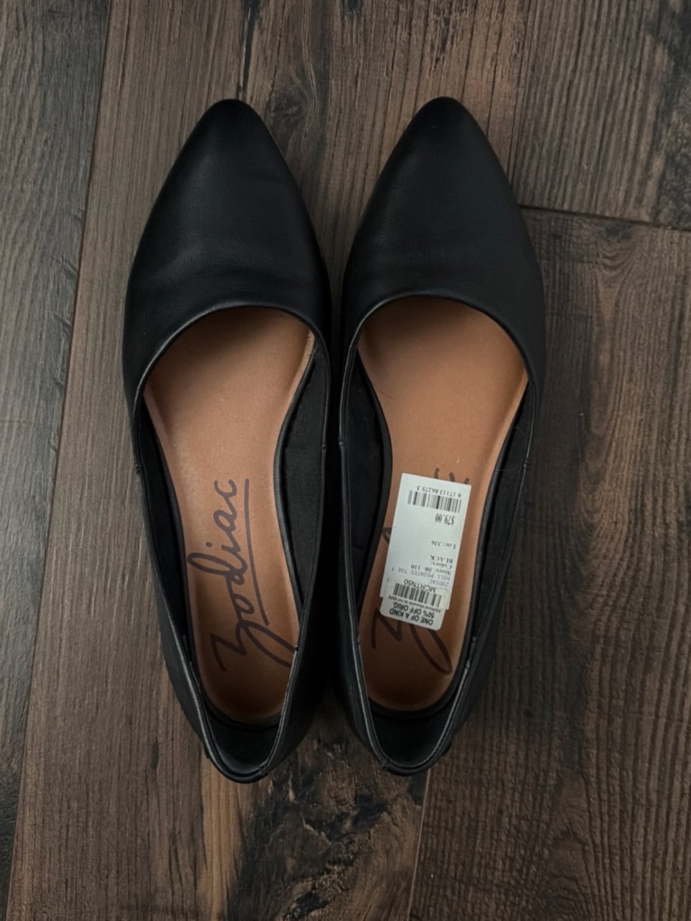 Zodiac Black Pointed-Toe Slip-On Flats with Tan Insole